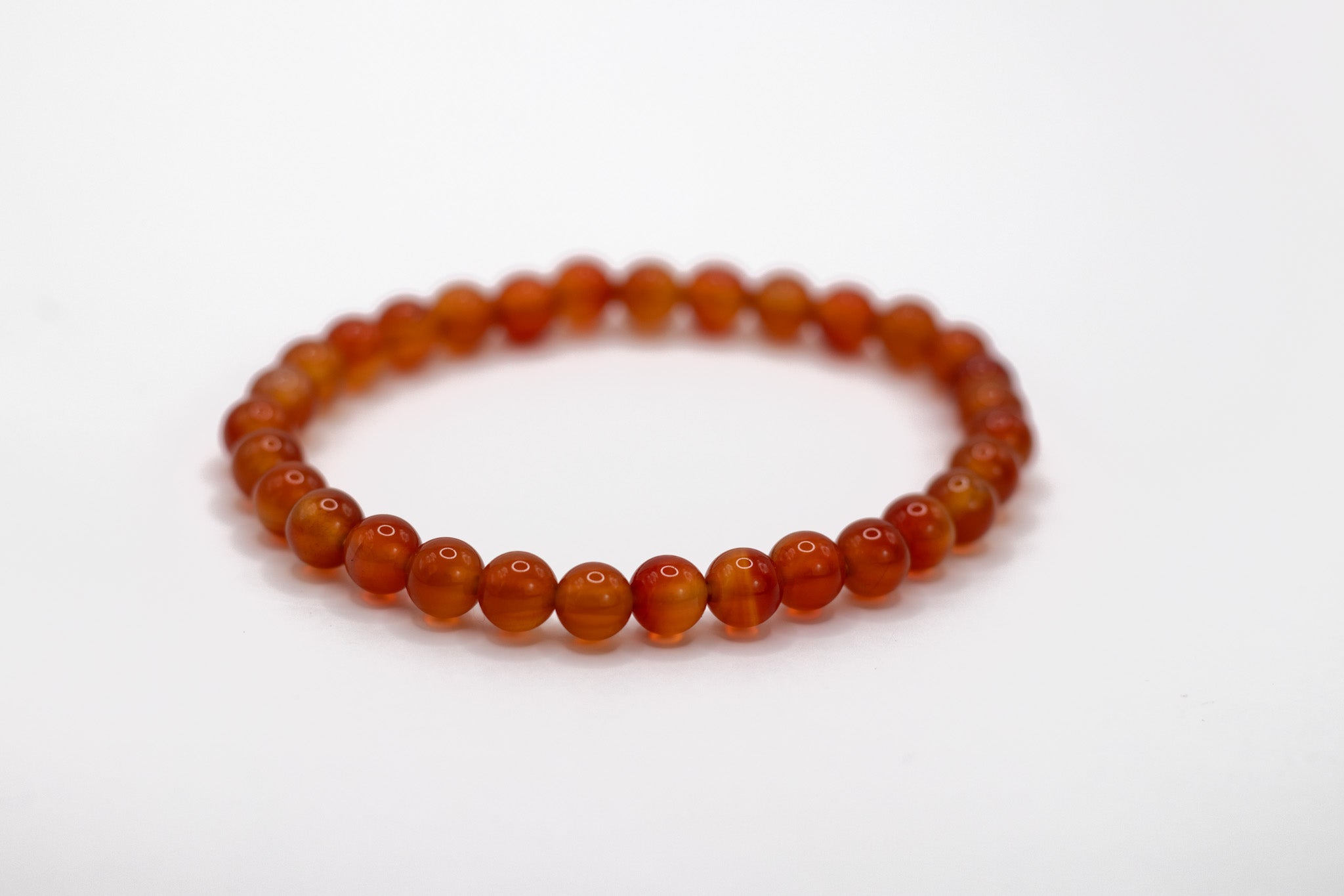 Flexibles Karneol Kugelarmband mit 6 mm Edelsteinen – AAA-Qualität, fördert Energie, Kreativität und Selbstvertrauen.